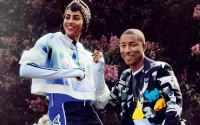 Imaan Hammam avec Pharrell Williams en couverture de Vogue