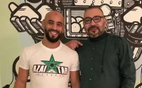Photo : le roi Mohammed VI et Ottman Azaitar